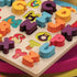 B. Toys Alpha. B. Tical Wooden Alphabet Puzzle